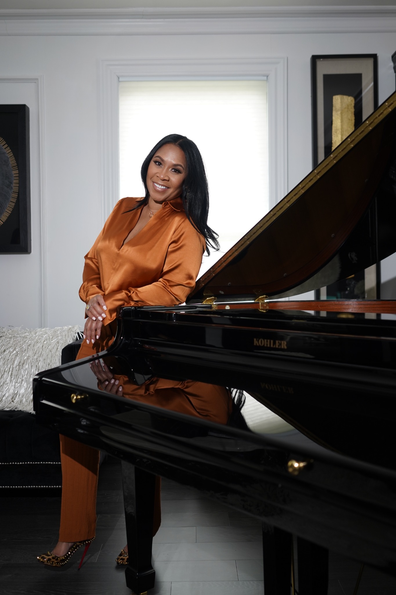 Arkell Cox standing beside a grand piano